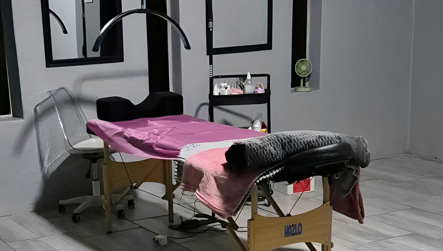 Tranquil treatment room at Dramatyes Lash Lounge, Springs, Gauteng, ZA, featuring a cozy bed and elegant decor.