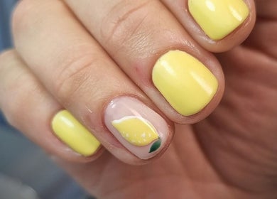 Lemon nail art design at Bee You Nails, Warsash, England, GB, featuring vibrant yellow polish.