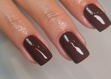 Elegant mocha nail art at Bee You Nails, Warsash, England, GB, showcasing perfect glossy finish.