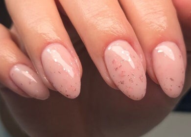 Elegant pink manicure with glitter at Bee You Nails, Warsash, England, GB.