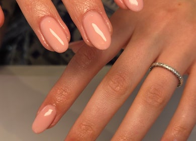 Glowing pink manicured nails from Bee You Nails in Warsash, England, GB.