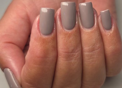 Stylish taupe manicure at Bee You Nails, Warsash, England, GB showcasing expert nail art design.