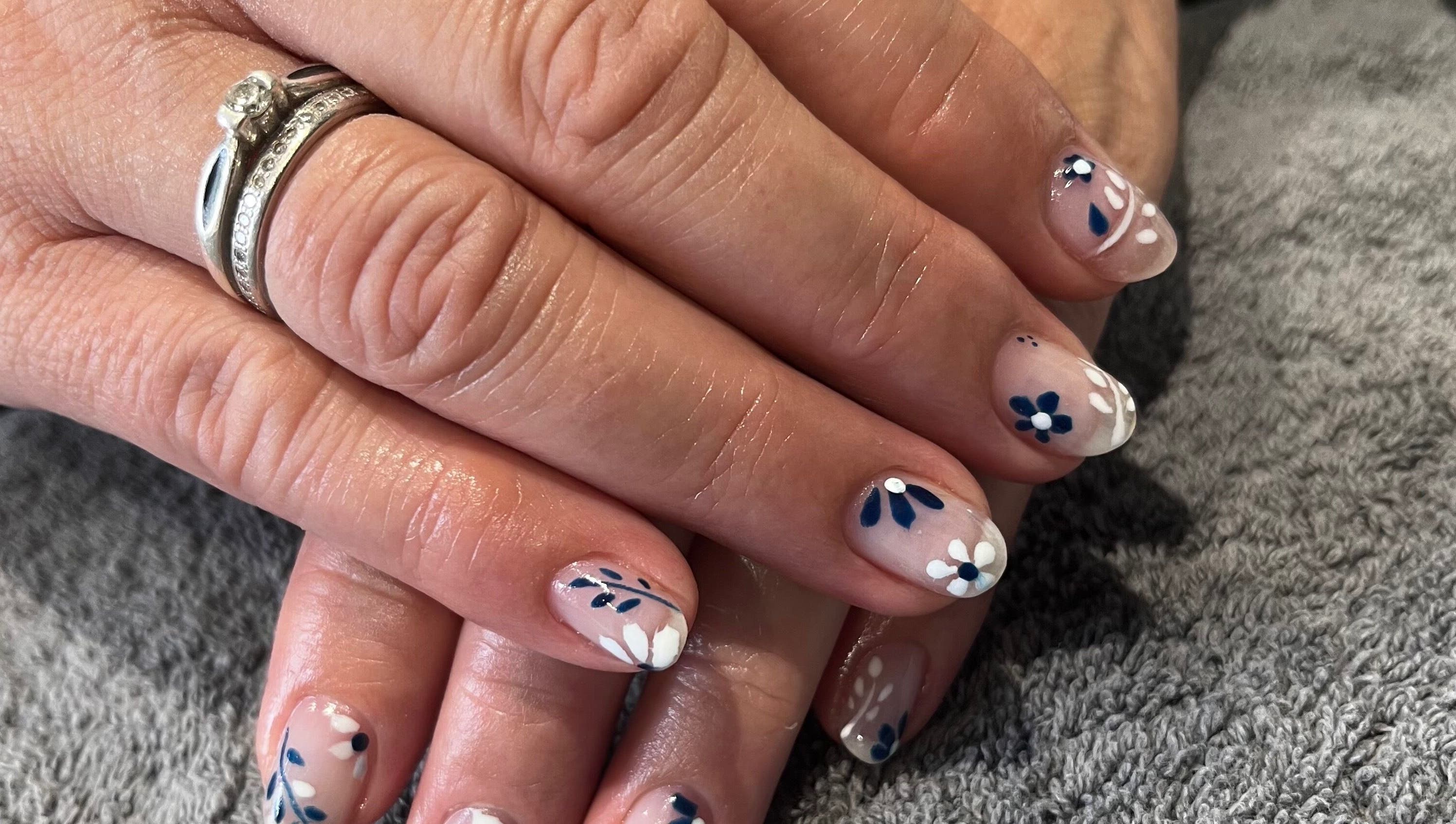 Beautiful hand-painted floral nails at Nadine Louise in Salisbury, England, GB.