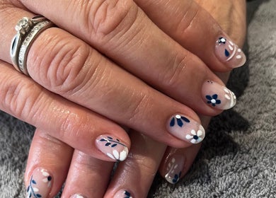 Beautiful hand-painted floral nails at Nadine Louise in Salisbury, England, GB.