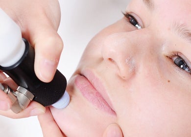 Facial treatment at Nadine Louise, Salisbury, England, GB, highlighting expert skin rejuvenation techniques.