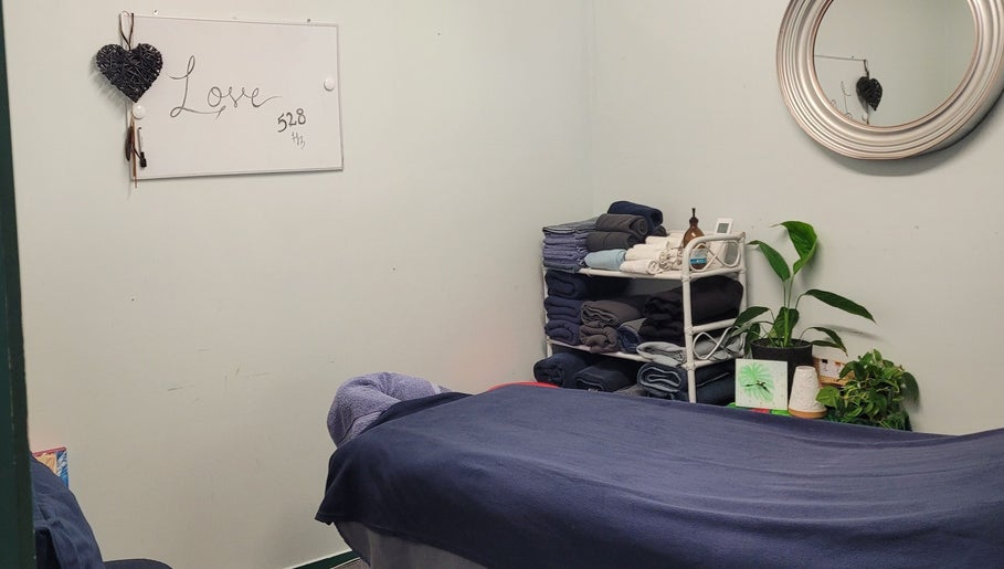 Relaxing massage room at Amorah Rose Intuitive, Whakatane, Bay Of Plenty, NZ with soothing decor and cozy linens.