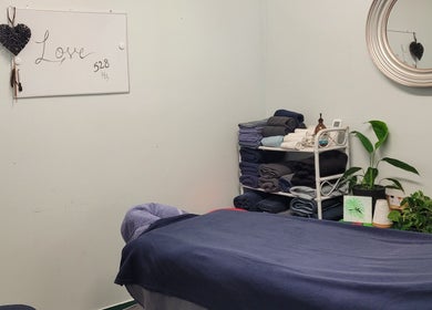 Relaxing massage room at Amorah Rose Intuitive, Whakatane, Bay Of Plenty, NZ with soothing decor and cozy linens.