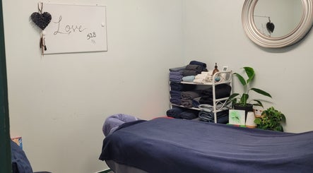 Relaxing massage room at Amorah Rose Intuitive, Whakatane, Bay Of Plenty, NZ with soothing decor and cozy linens.