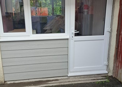 Entrance of H Gcreativehair, featuring modern doors, Plymouth, England, GB.