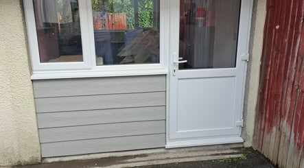 Entrance of H Gcreativehair, featuring modern doors, Plymouth, England, GB.