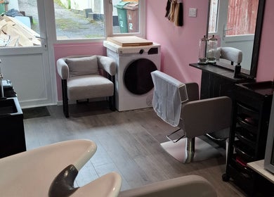 Chic salon interior at H Gcreativehair, featuring modern seating and styling stations in Plymouth, England, GB.