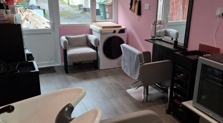 Chic salon interior at H Gcreativehair, featuring modern seating and styling stations in Plymouth, England, GB.