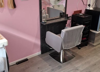 Salon chair and styling station at H Gcreativehair, Plymouth, England, GB featuring modern decor.