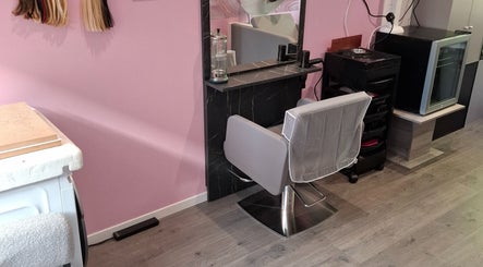 Salon chair and styling station at H Gcreativehair, Plymouth, England, GB featuring modern decor.