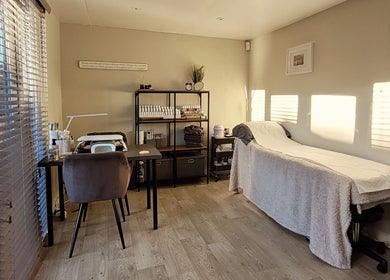 Relaxing interior of Beauty by Leanne in Timperley, England, GB, showcasing a treatment bed and cozy ambiance.