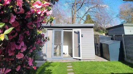Garden view of Beauty by Leanne in Timperley, England, GB with blooming pink flowers.