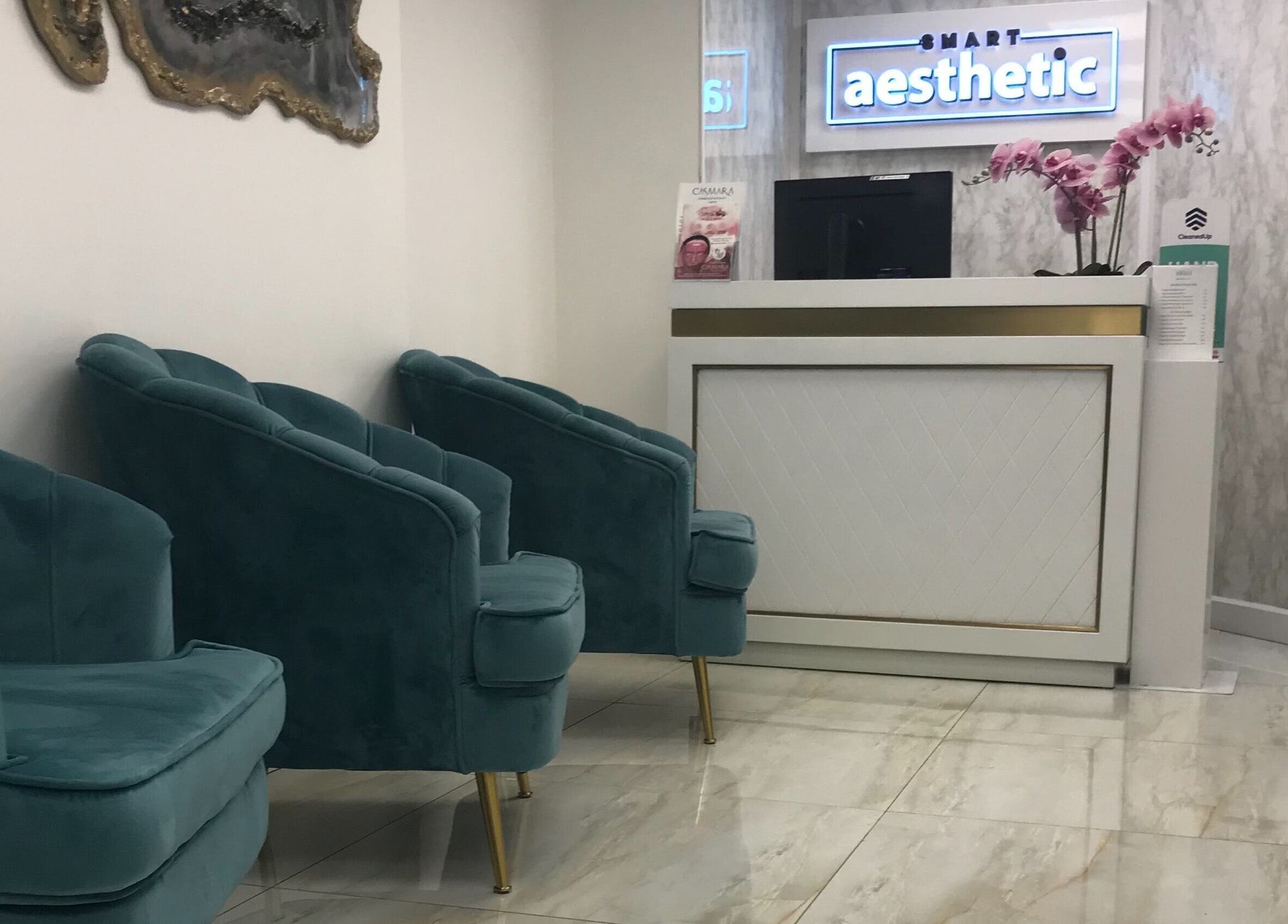 Chic reception area at Sonis Body and Mind, London, England, GB, featuring plush seating and modern decor.