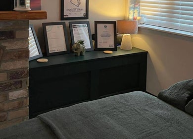 Pembrokeshire Sports Massage therapy room in Begelly, Wales, GB with framed certificates and a calming ambiance.