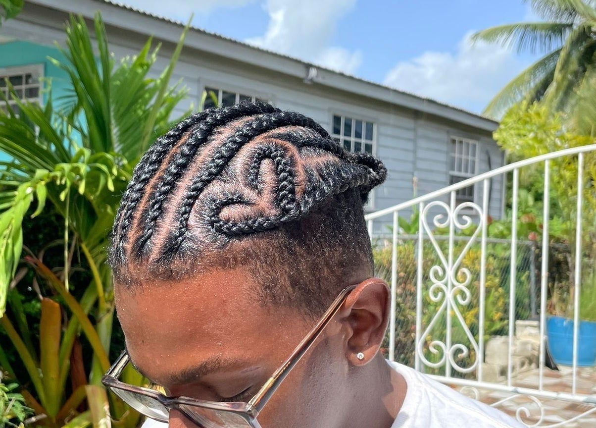 Unique braided hairstyle at Flux Beauty in Oistins, Christ Church, BB, showcasing creativity and style.