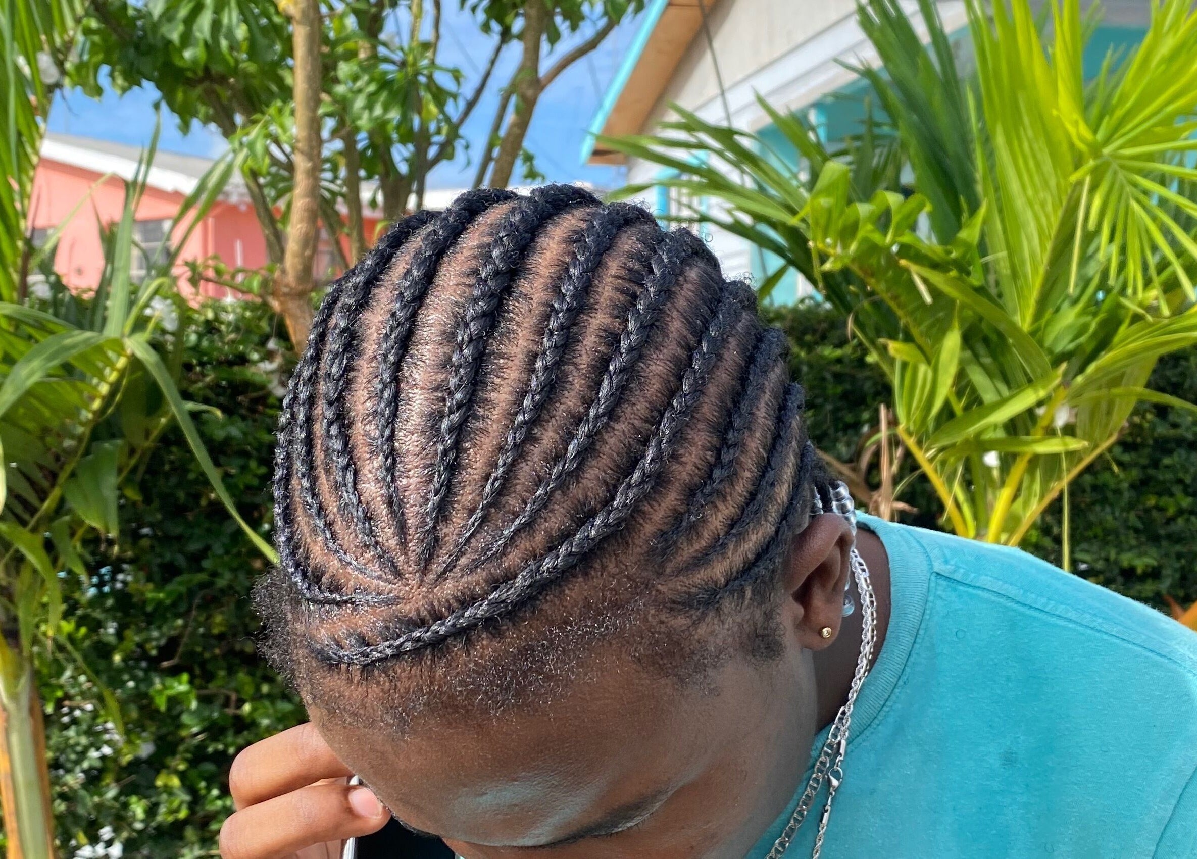 Close-up of intricate cornrow hairstyle at Flux Beauty in Oistins, Christ Church, BB.