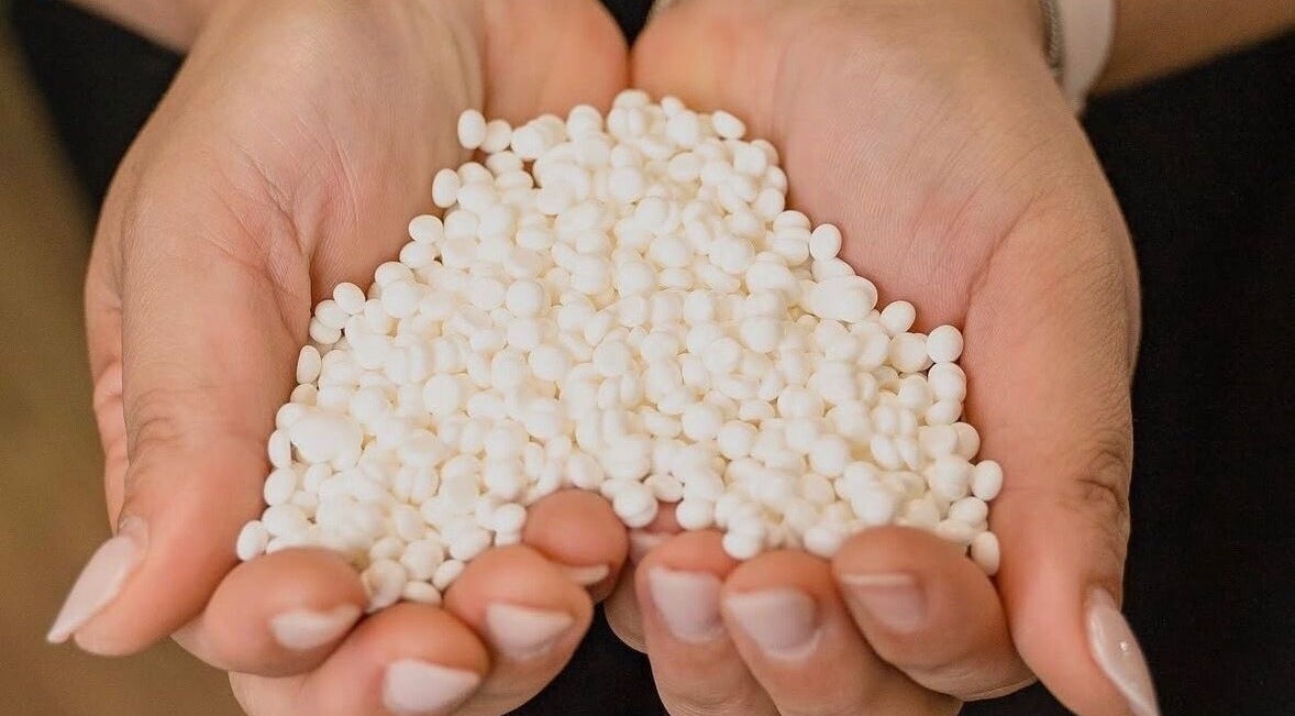 Handful of white wax beads at Wax and Beauty, Dublin, County Dublin, IE, perfect for smooth waxing.
