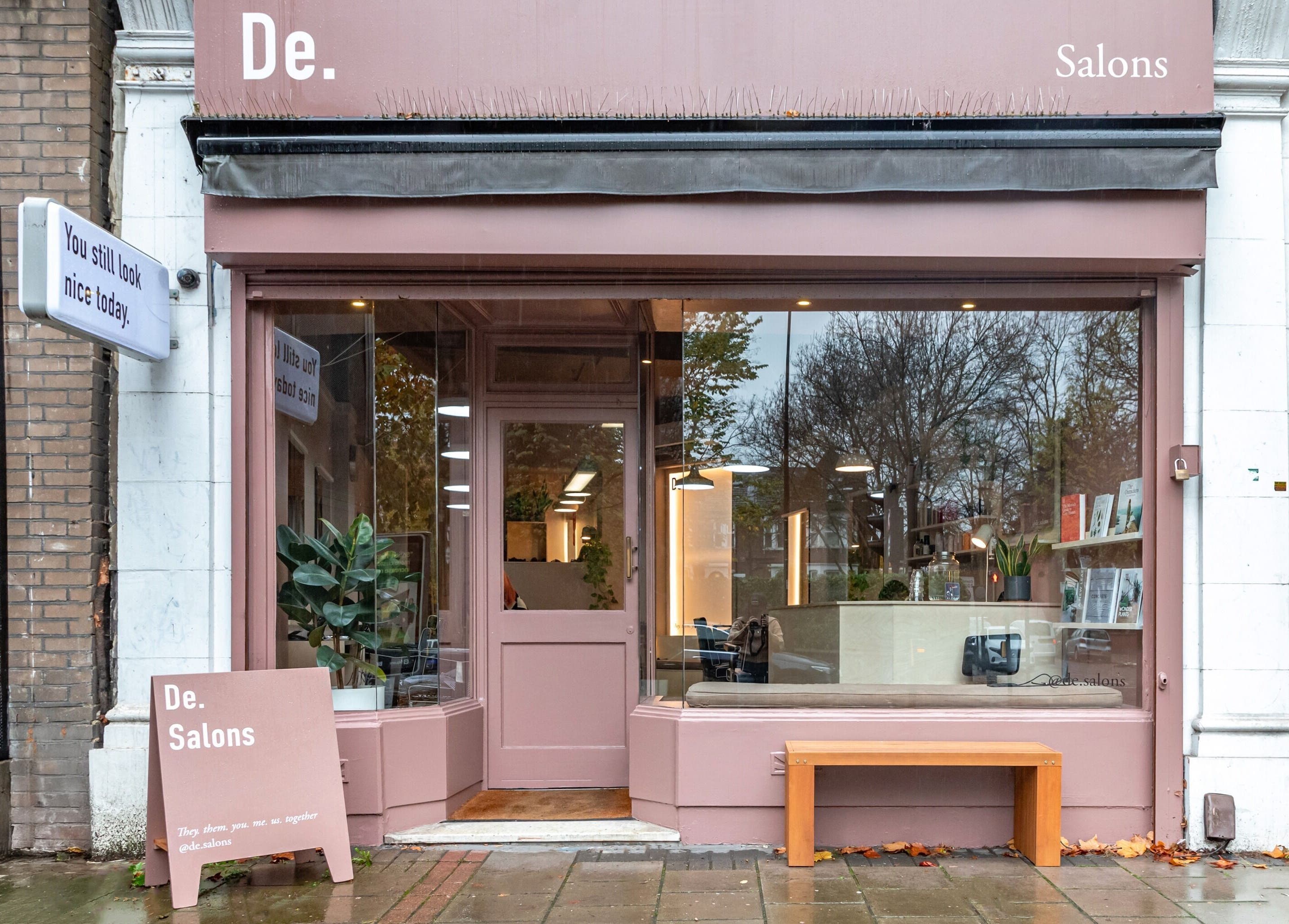 Exterior view of De Salons Brixton in London, England, GB. Inviting pink facade with modern design.