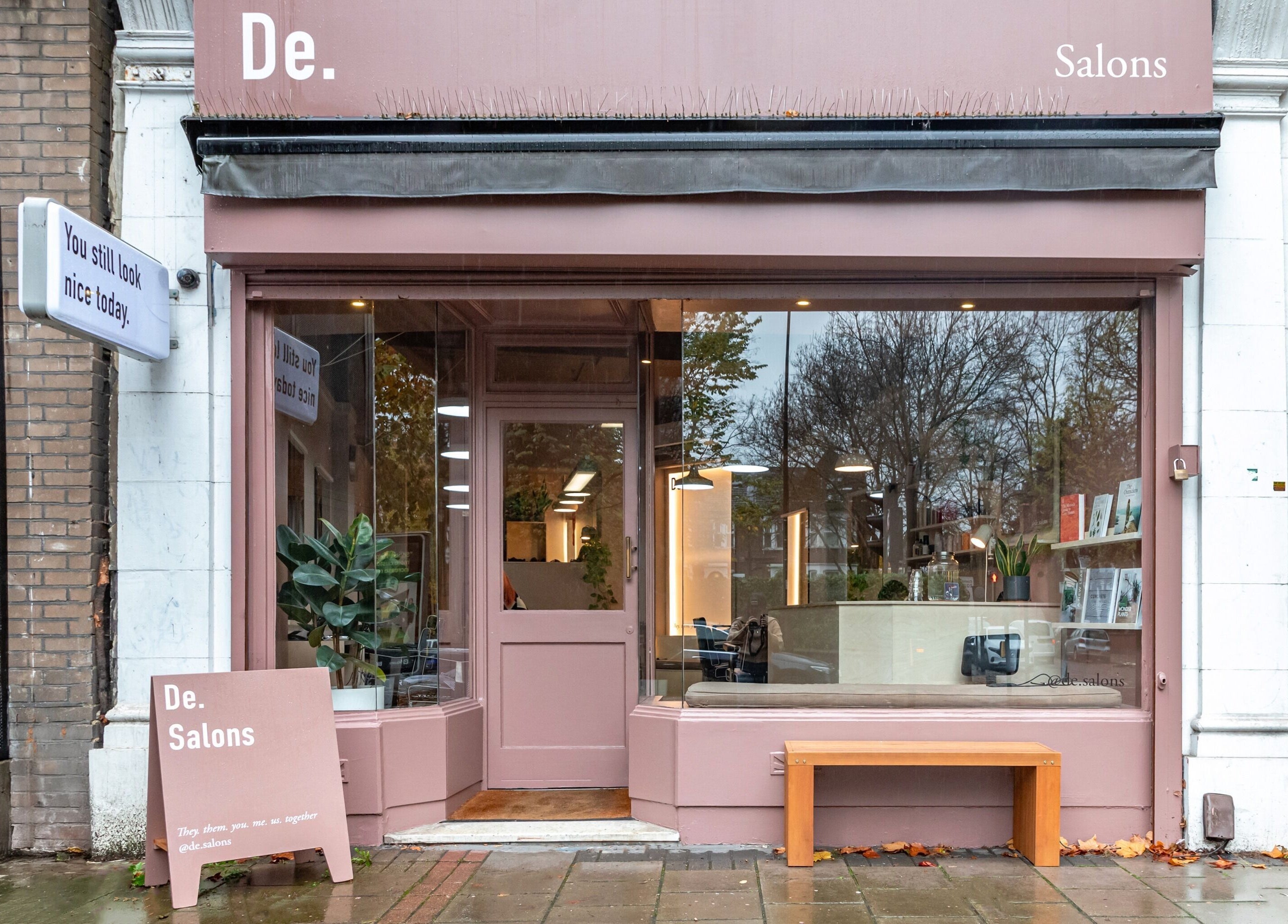 Exterior view of De Salons Brixton in London, England, GB. Inviting pink facade with modern design.