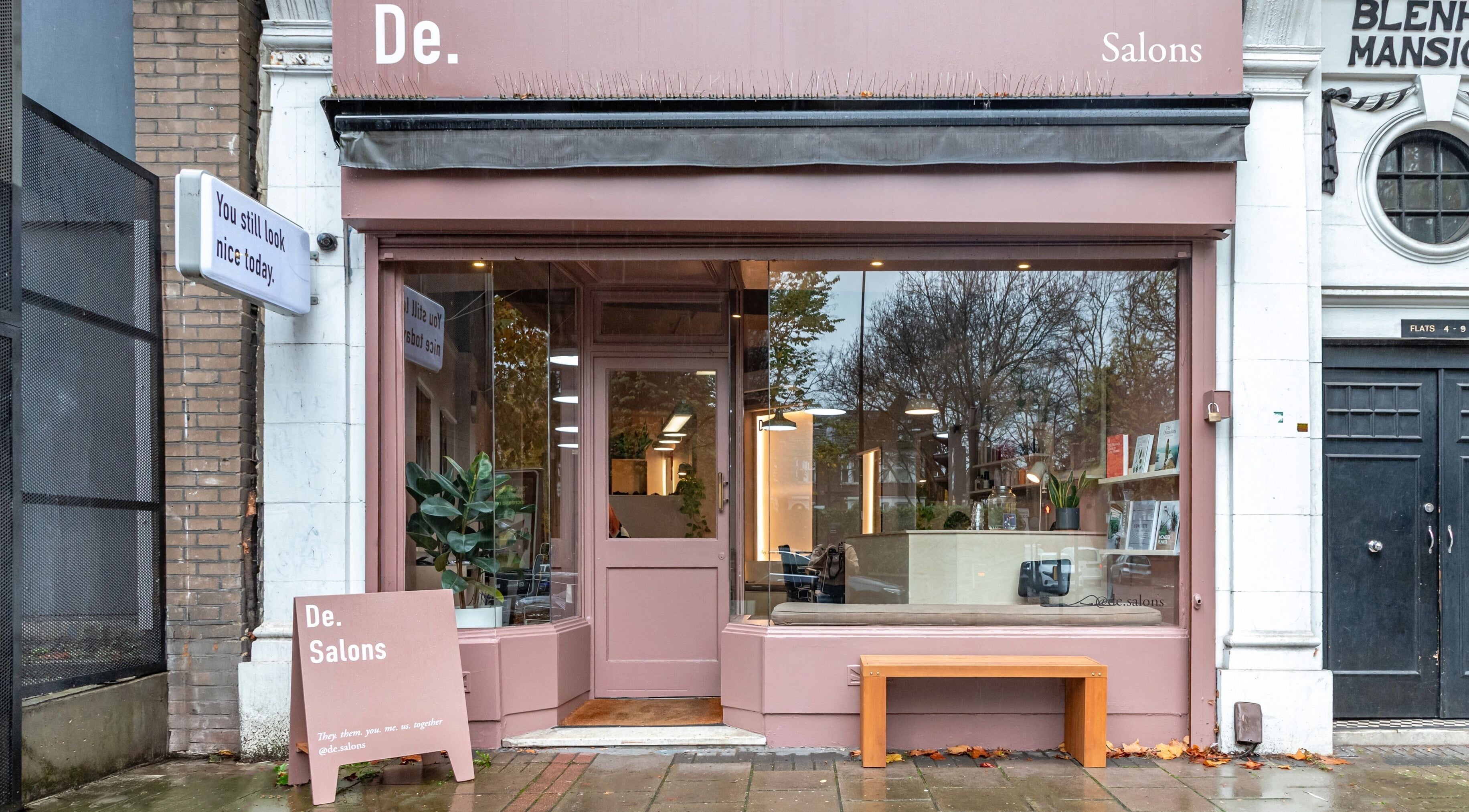 Exterior view of De Salons Brixton in London, England, GB. Inviting pink facade with modern design.