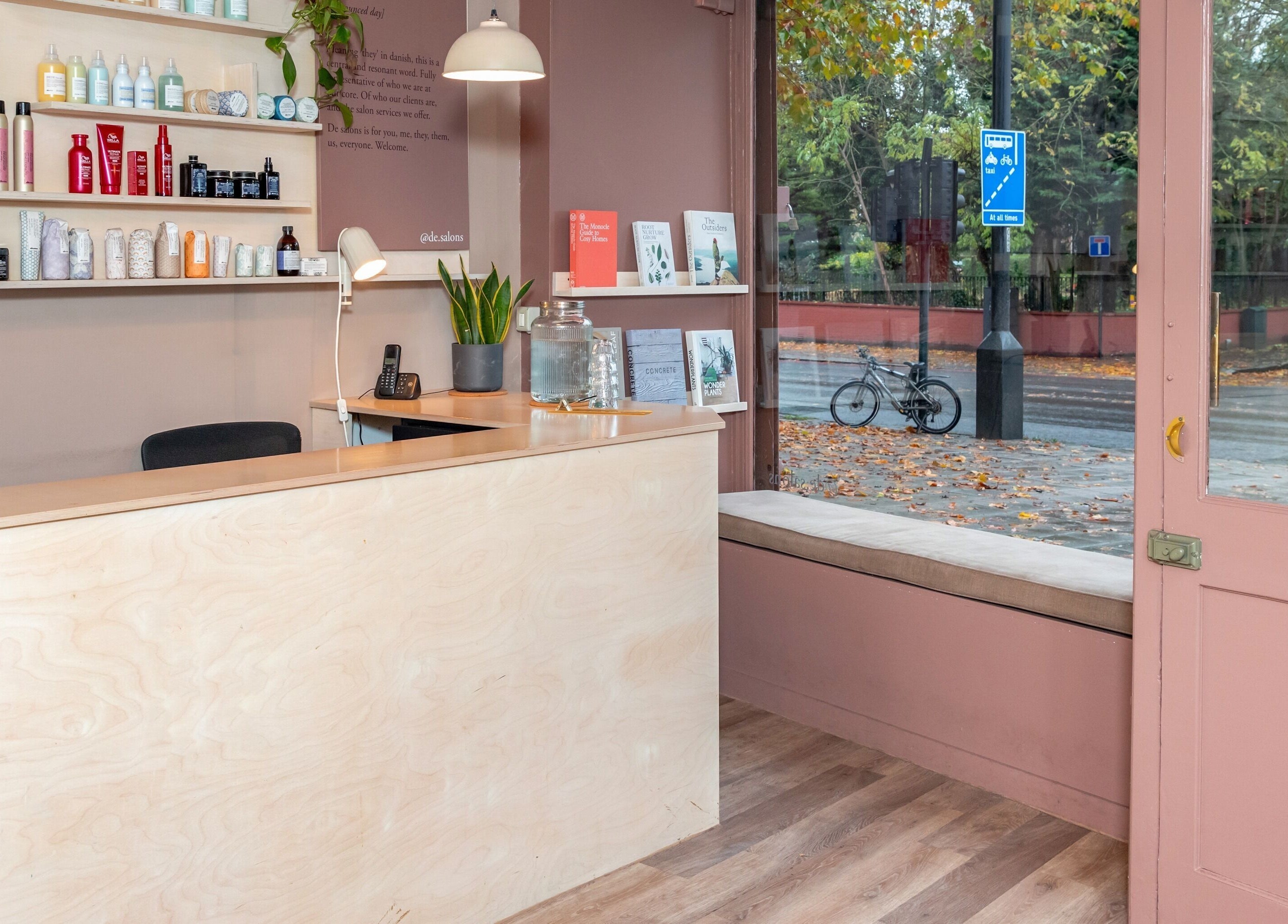 Reception area of De Salons Brixton in London, England, GB with elegant product display and natural light.