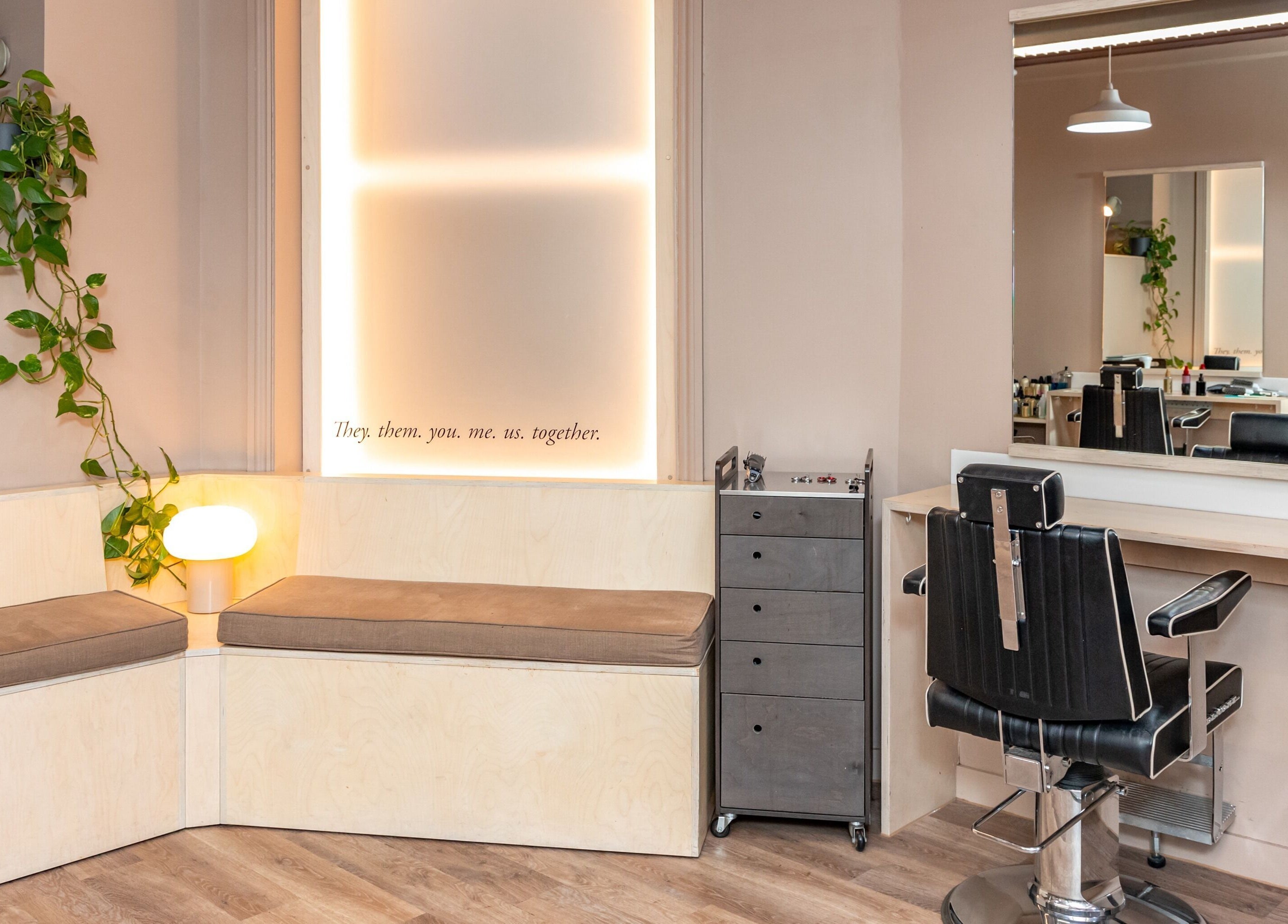 Modern salon seating and styling station at De Salons Brixton, London, England, GB.