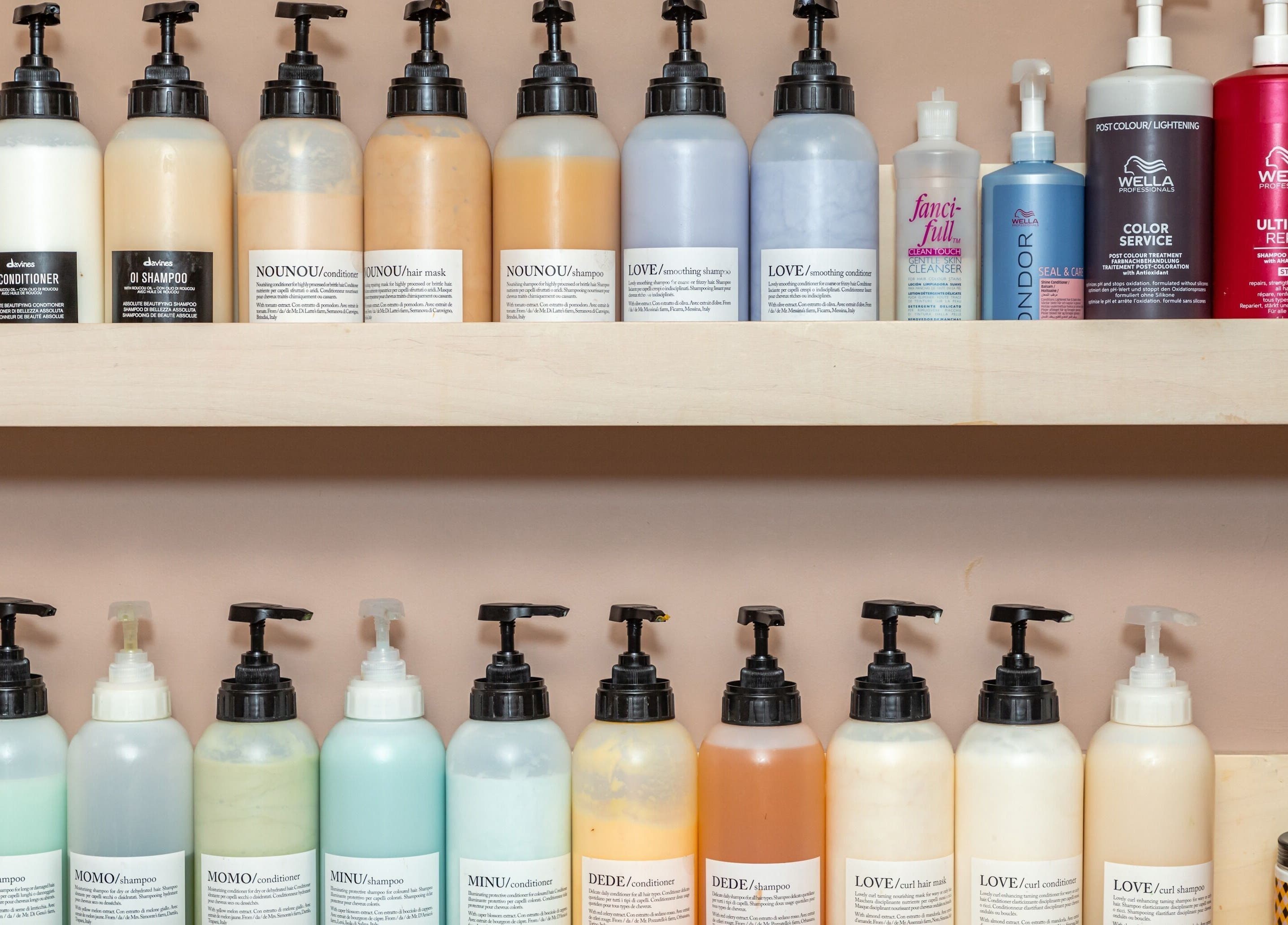 Assorted hair care products on display at De Salons Brixton, London, England, GB.