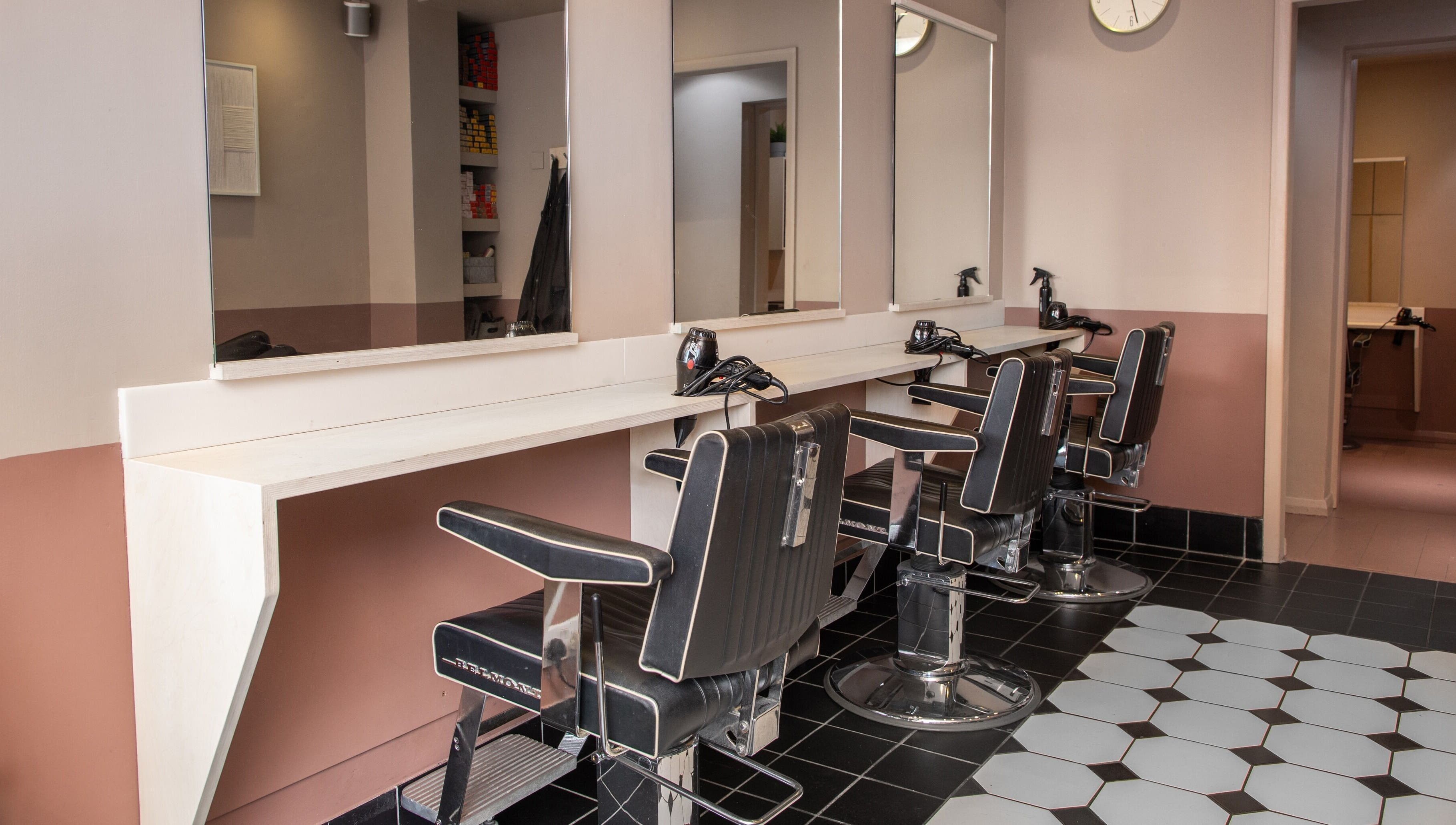 Elegant salon chairs and mirrors at De.Salons Peckham, London, England, GB.