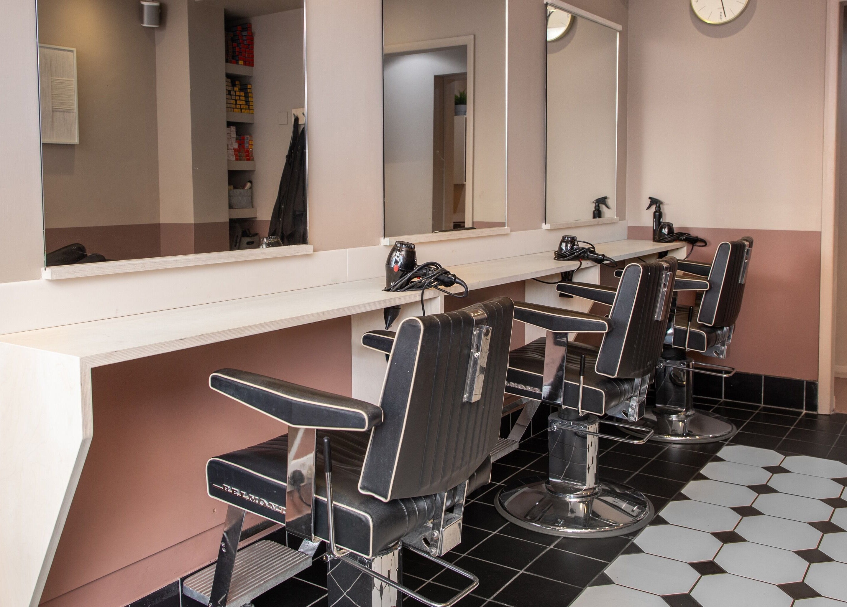 Elegant salon chairs and mirrors at De.Salons Peckham, London, England, GB.