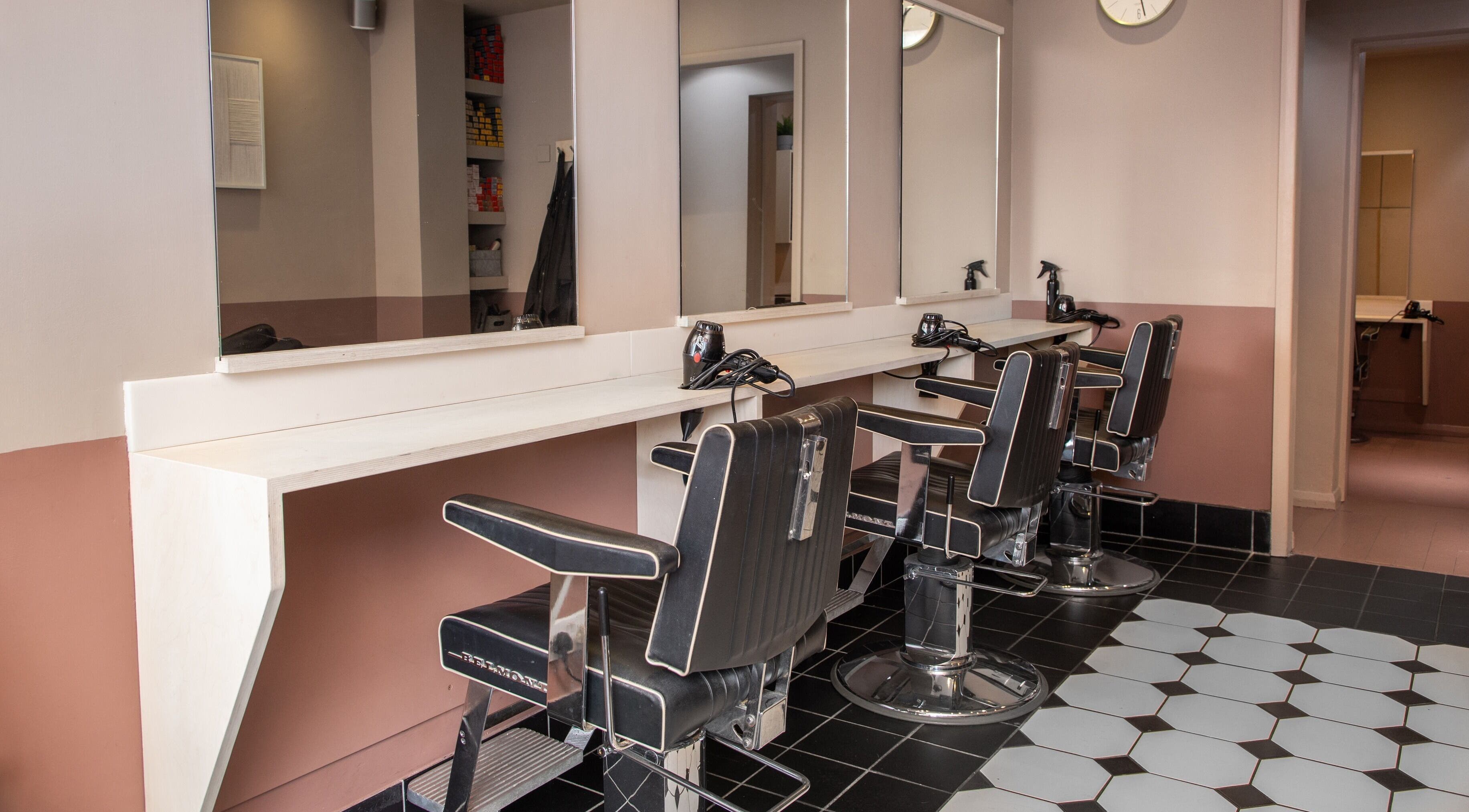 Elegant salon chairs and mirrors at De.Salons Peckham, London, England, GB.