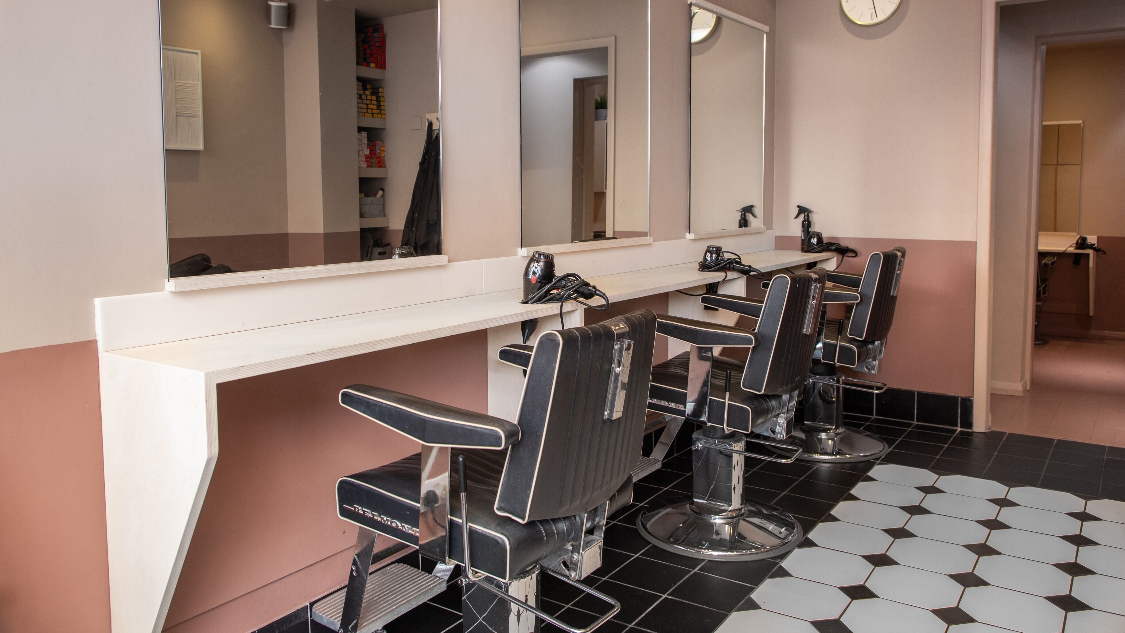 Elegant salon chairs and mirrors at De.Salons Peckham, London, England, GB.