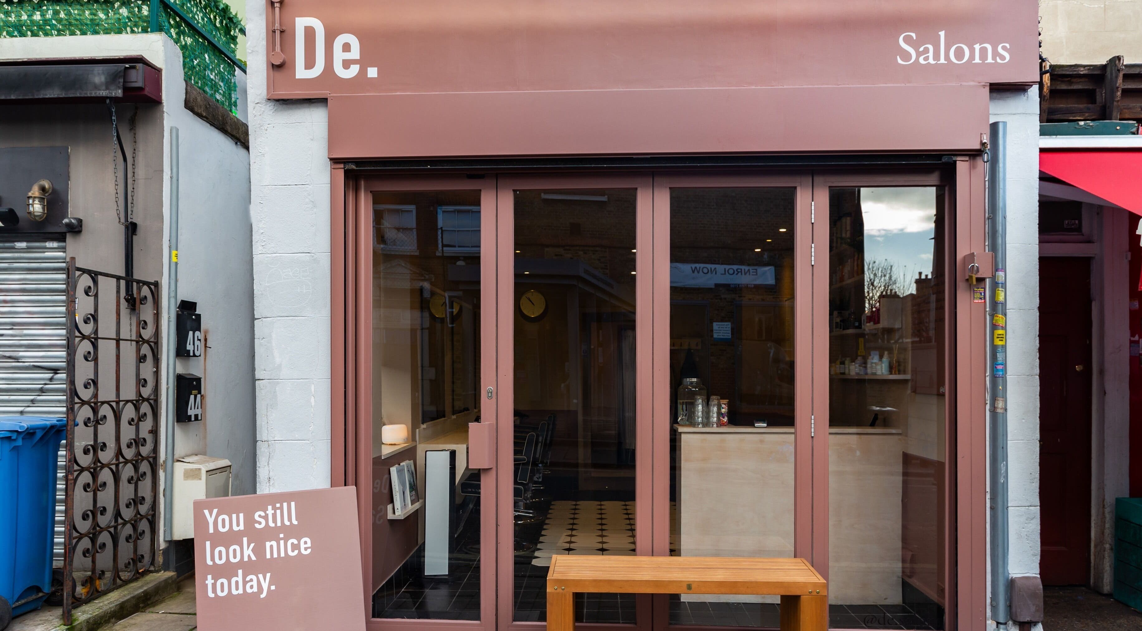 De.Salons Peckham exterior with welcoming entrance in London, England, GB, highlighting unique signage.