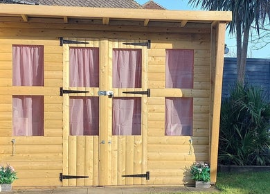 Wooden cabin with pink curtains, a serene addition at AllAboutNailz, Stubbington, United Kingdom, GB.