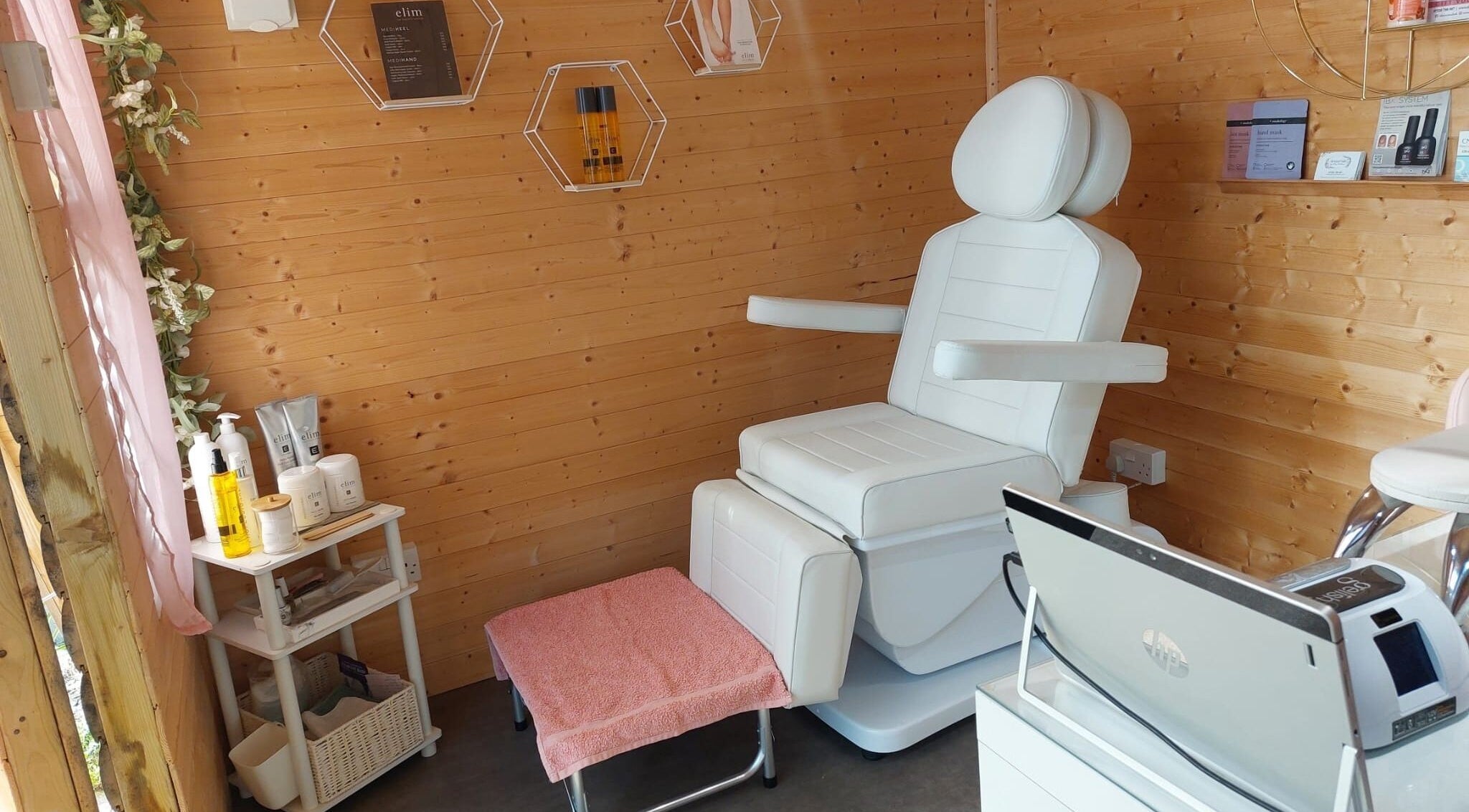 AllAboutNailz cozy treatment room, Stubbington, United Kingdom, GB, featuring a plush white chair and wooden decor.