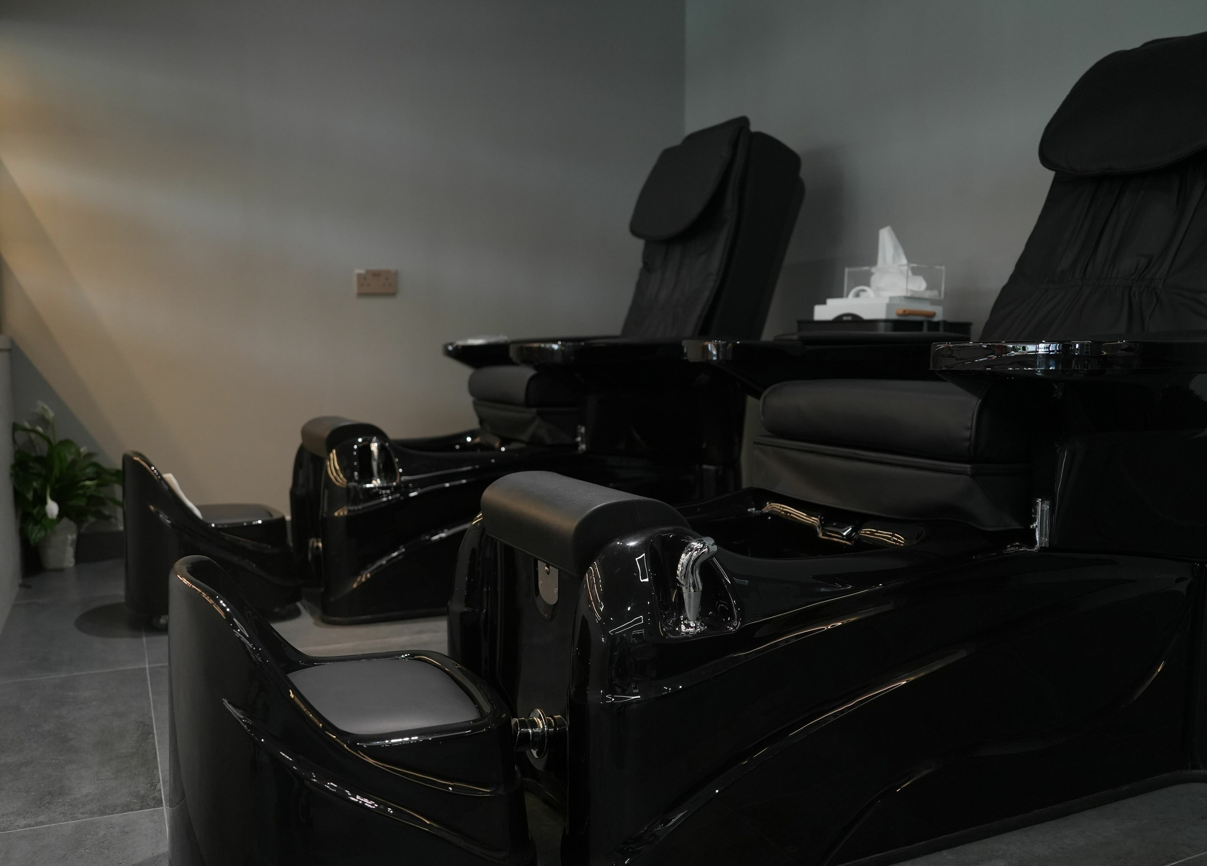 Luxurious pedicure chairs at Abroshka Gents Salon, Dubai, AE offering a premium grooming experience.