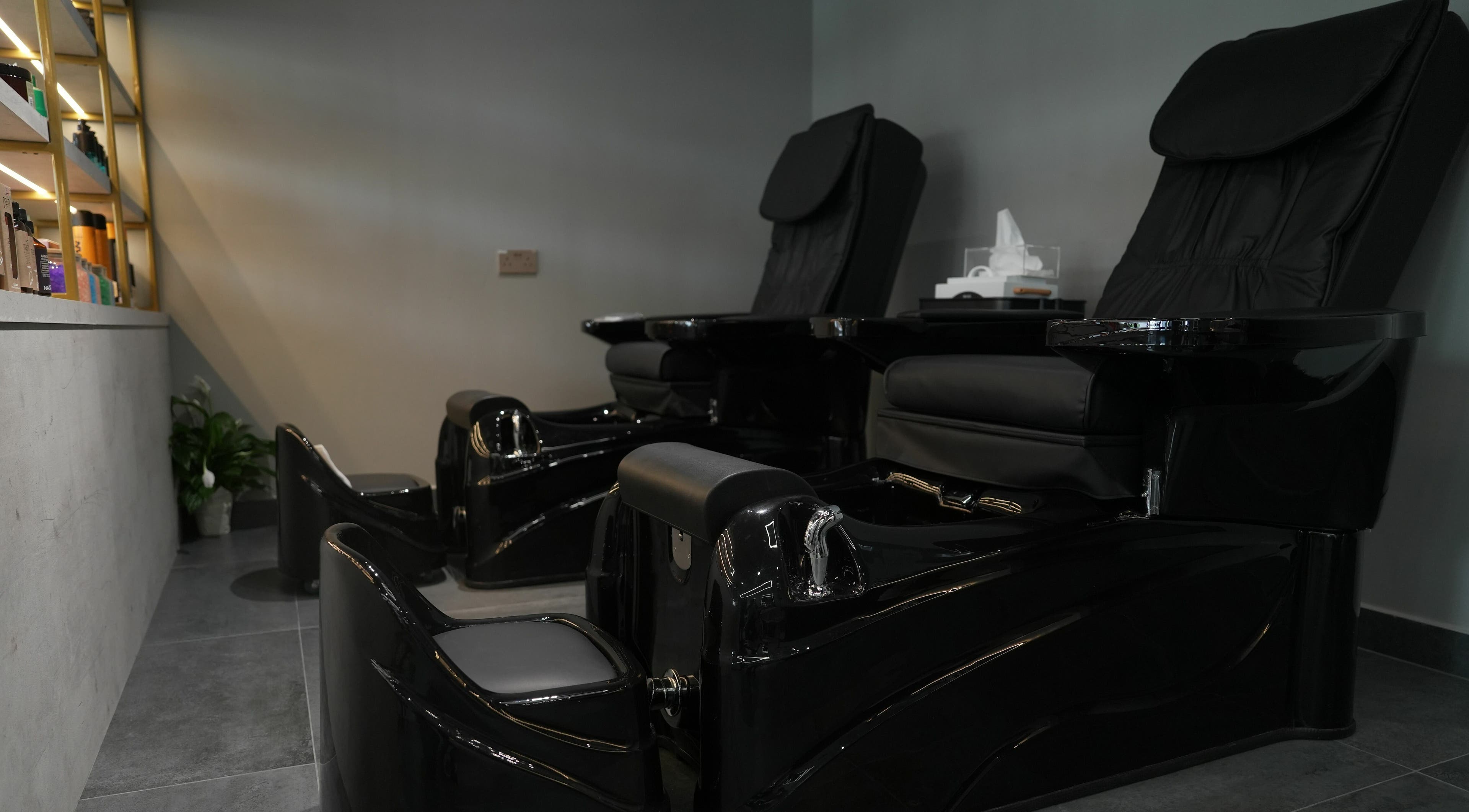Luxurious pedicure chairs at Abroshka Gents Salon, Dubai, AE offering a premium grooming experience.