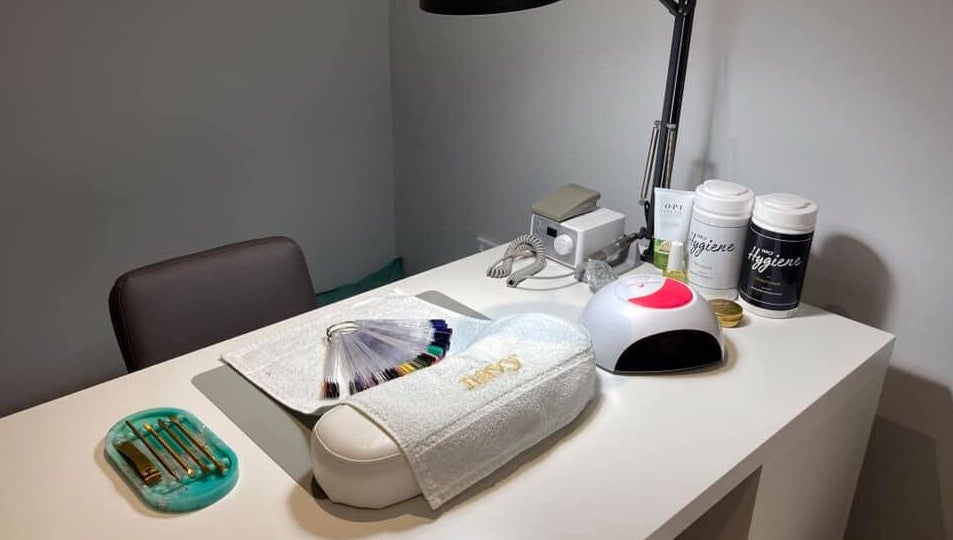 Nail station at Glamour and Glitter by Stef in Portchester, England, GB neatly organized with tools and nail samples.