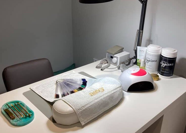 Nail station at Glamour and Glitter by Stef in Portchester, England, GB neatly organized with tools and nail samples.