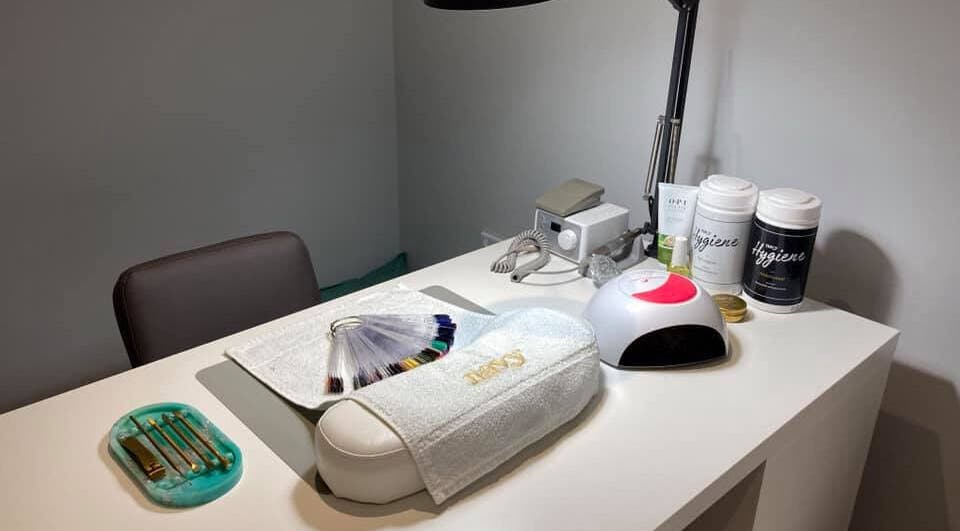 Nail station at Glamour and Glitter by Stef in Portchester, England, GB neatly organized with tools and nail samples.