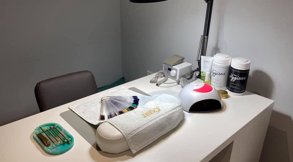 Nail station at Glamour and Glitter by Stef in Portchester, England, GB neatly organized with tools and nail samples.