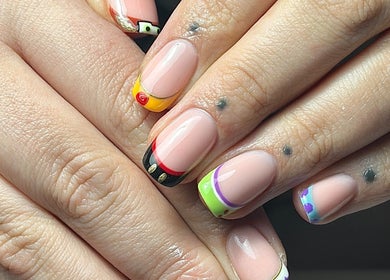 Colorful nail art at Roots Hair & Co, Needham Market, England, GB showcasing unique designs.