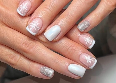 Snowflake nail art with silver shimmer at Roots Hair & Co, Needham Market, England, GB.