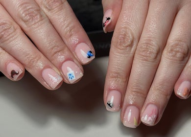 Detailed nail art showcasing creative designs at Roots Hair & Co, Needham Market, England, GB.