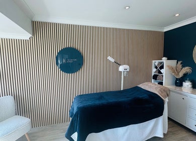 Elegant spa room at The Rectory Retreat, Rochford, England, GB with a cozy treatment bed and calming decor.