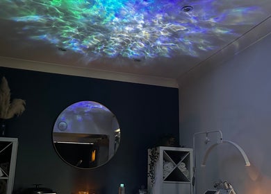 Relaxing therapy room at The Rectory Retreat, Rochford, England, GB with calming lights and soothing decor.