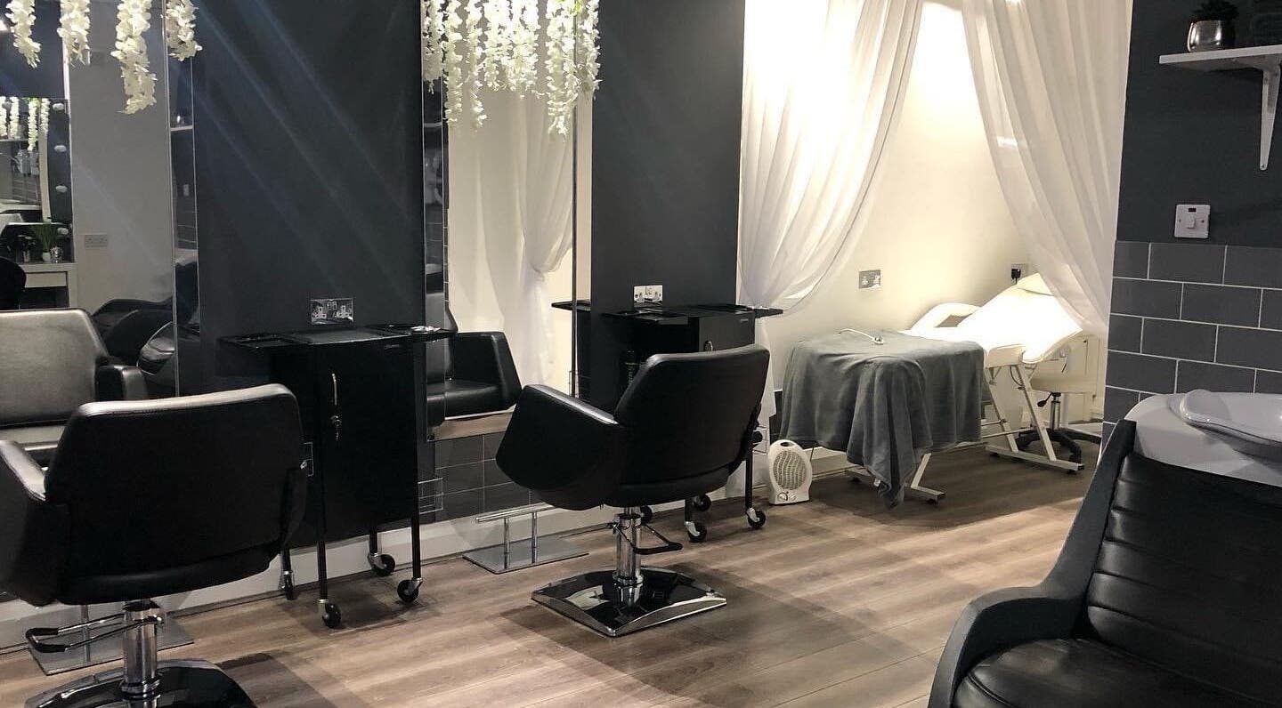 Interior of Kalis Aesthetics in Rhyl, Wales, GB featuring modern salon chairs and relaxing ambiance.